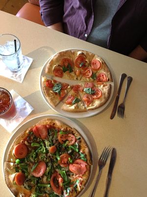 V cheese, spinach, garlic chunks, Roma tomatoes, caramelized onions, broccoli at Brixx Wood Fired Pizza in Franklin