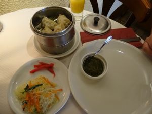 Main dish of steamed dumplings with noodle salad and sauce at Pema Thang in Paris