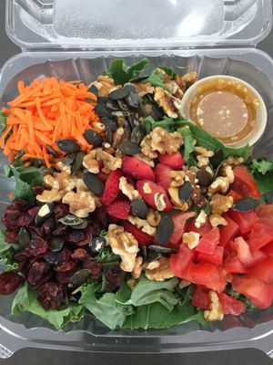 Kale Superfood Salad- Kale, Tomato, Strawberry,Cranberry, Walnut, Pumpkin Seed, Carrots and Orange Carrot Ginger Dressing at LOVJuice in Boca Raton
