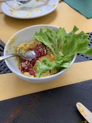 Hummus with onions on top   at Selezione Naturale in Turin