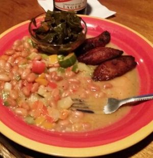 stew peas, plantains, collard greens, and red stripe. at Red Stripes Caribbean Cuisine and Lounge in Bluffton