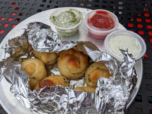 Garlic Knots with ranch, pesto, and marinara sauces at Sizzle Pie - W Burnside in Portland