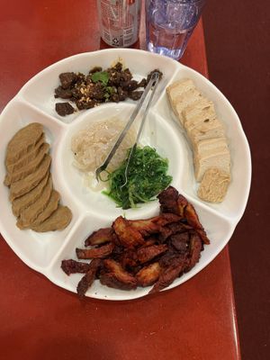 Appetizer plater- beef jerky, BBQ meat, chicken, jelly fish, fresh seaweed. BBQ our fav!  at Bodhi Kosher Vegetarian Restaurant in New York City