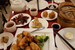BBQ veg meat, fried taro dumplings, pan fried dumplings, soup dumplings, fake shrimp with walnut, shumai, tea at Bodhi Kosher Vegetarian Restaurant in New York City
