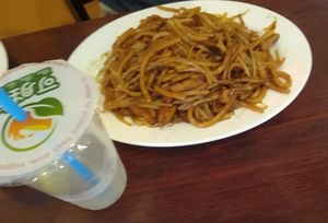 fried noodle dish (+iced tea) at Bodhi Kosher Vegetarian Restaurant in New York City