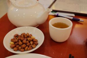 Tea and free peanuts.  Mmm. at Bodhi Kosher Vegetarian Restaurant in New York City
