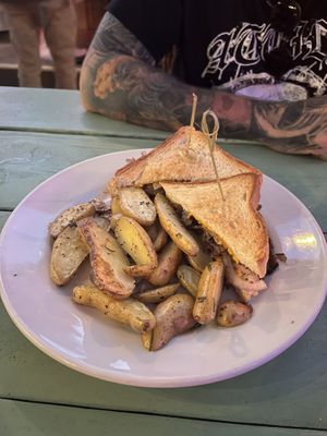 Seitan Philly with herb seasoned potatoes , cooked soft   at The Top in Gainesville