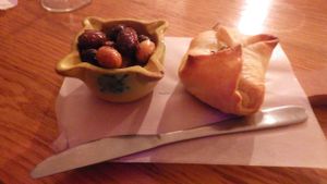 Baked almond cheese in pastry with olives at Alaska Bar in Berlin