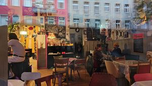 The bar through the windows at Alaska Bar in Berlin