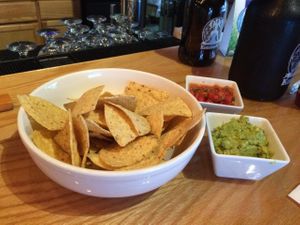 Guacamole, salsa, and chips at One Kombucha in Lake Park