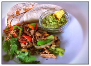 Alambre de seitan, seitan fried with vegetables and vegan cheese, guacamole and tortillas.... at Gandhi Veggie in Barcelona