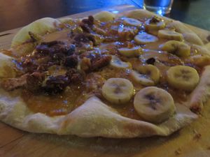 Customised sweet pizza: one half with bananas and the other one with dried figs at Pizza LAB in Leipzig