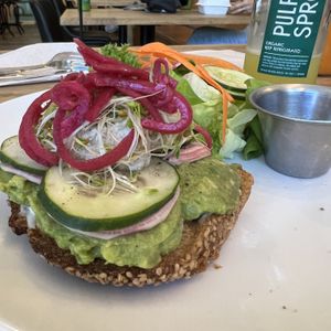 Avo Toasty 😋 with Shine juice  at Pulp + Sprout Juice Bar and Vegan Cafe in Asheville