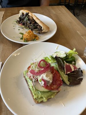 Mushroom bahn mi with sweet potato salad, avo toast with Caesar salad   at Pulp + Sprout Juice Bar and Vegan Cafe in Asheville
