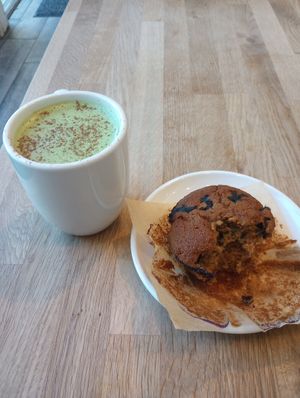 Matcha Mylk and blueberry muffin at Pulp + Sprout Juice Bar and Vegan Cafe in Asheville
