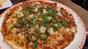 Spicy pizza with jalapenos, ground sausage, and pineapple at VegeNation in Las Vegas