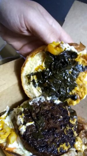 Greens, Mac, n coleslaw on a burger at VegeNation in Las Vegas