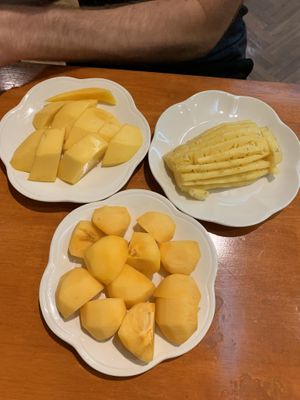 Mango, pineapple, persimmon at Baiyoke Sky Hotel Fruit Buffet in Bangkok