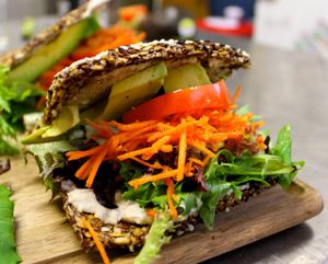 Raw Sandwich - dehydrated flax seed bread, basil cashew nut cheese, tomato, carrot, lettuce, avocado. at Karanaki's Raw Food in Fremantle