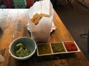 Chips and 3 salsas + guacamole  at Hola Arepa in Minneapolis