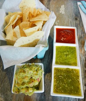 chips salsas and guac at Hola Arepa in Minneapolis