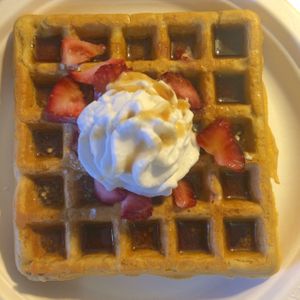 gluten free vegan waffle with maple strawberry and coconut whipped cream.   at Planet Yum in Vero Beach