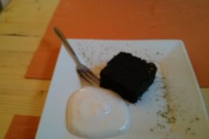 Charcoal cake and vegan whipped cream. at Equilibrio in La Spezia