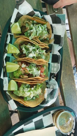Different tacos with sauce salsa verde at Momencik in Warsaw