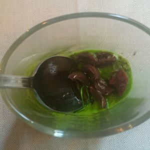 Amuse-bouche - pal choy, olives, sundried tomatoes at Konnubio in Florence
