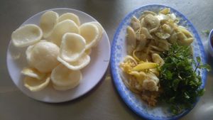 Fried mushroom with lemon grass and vegan prawn crackers. at An Nhu in Hoi An