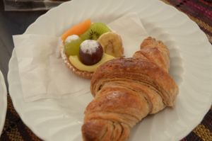 Fruit-covered pastry and croissant at Fratelli Piermattei in Rome