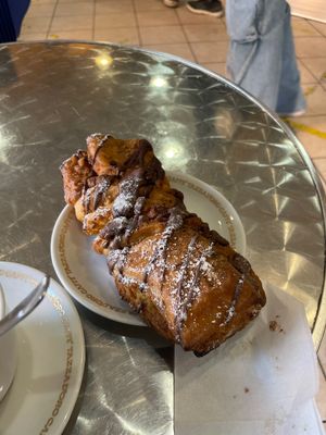 Brioche di pasta sfoglia e cannella ricoperta con cioccolato   at Fratelli Piermattei in Rome