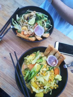 Two different bowls with added springrolls at King CookDaily in East London