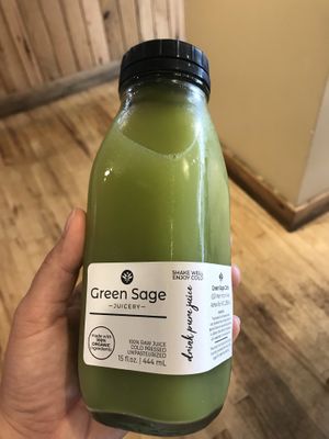 Green juice in a glass bottle. at Green Sage Cafe - Westgate in Asheville