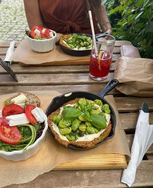 chickpea omelette with broad beans, cashew cream, bread with vegan butter and small salad at Wegarnik in Zielona Gora