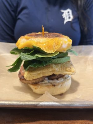I salivate as I write this, but here is the Supreme Ruth in all its beauty. An english muffin with two meaty patties, slice of cheese, a folded egg, in all its saucy goodness.  at The Lunch Room Bakery & Cafe in Ann Arbor