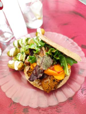 Seitan pita sandwich with house made cheese! Potatoes with pesto and mayo. at La Camelia Vegan Bar in Bilbao