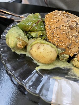 Burger 😏 potatoes with green sauce were delicious though! at La Camelia Vegan Bar in Bilbao