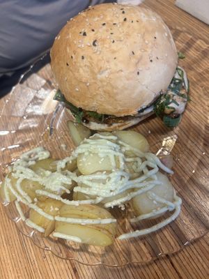 Burger with baby potato side   at La Camelia Vegan Bar in Bilbao
