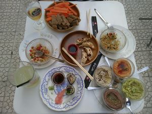 Chickpea salad, taboulé salad, gyozas, four dips and two makis at La Camelia Vegan Bar in Bilbao