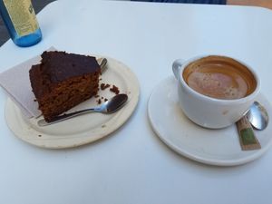 Cake with coffee at La Camelia Vegan Bar in Bilbao