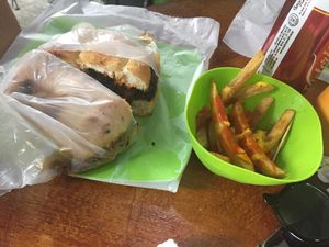 Salchicha torta and cheesy fries  at Vegan Pa' Cá' in Mexico City