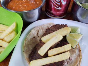 Taco de milanesa y papas a la francesa at Vegan Pa' Cá' in Mexico City