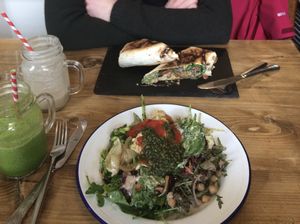 Salad plate with vegan pesto and hummus, and a falafel wrap.  at Beyond the Kale in Bath