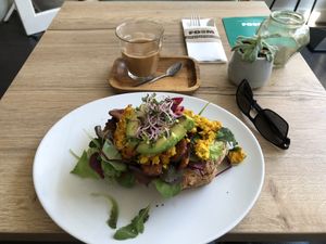Scrambled tofu with tempeh bacon and greens! Yummy!!! at FOAM in The Hague