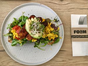 Scrambled tofu sandwich with avocado and tempeh bacon at FOAM in The Hague