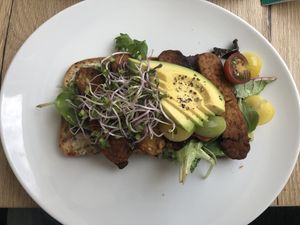 Toast with tempeh "bacon" and avocado at FOAM in The Hague