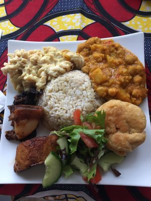 Small plate - mac & cheese, chickpea curry, brown rice, spelt dumpling, roasted potatoes and AMAZING mushrooms 😋  at LoveGift Vegan Cafe in South East London