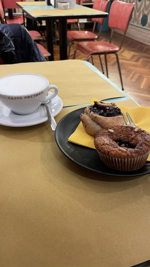 Rice-almond milk cappuccino, chesnut and sour cherry muffin and a sweet roll at Sweet Irene in Bergamo