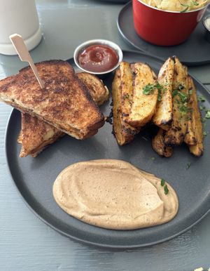 Sweet potato grilled cheese and side potato wedges.   at Shine Plant Based Kitchen in Orillia